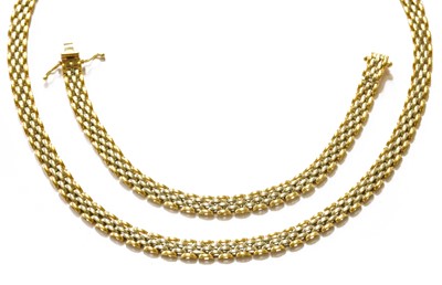 Lot 343 - An 18 carat bi-coloured gold necklace and...