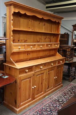 Lot 1237 - A Pine Farmhouse Dresser and Rack, 183cm by...