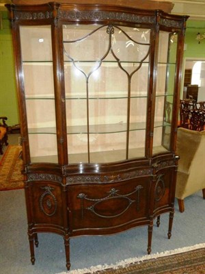 Lot 1236 - An Edwardian Mahogany Adams Revival Serpentine Display Cabinet, the anthemion decorated frieze...