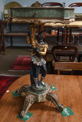 Lot 1356 - A pair of painted and parcel gilt blackamoor...