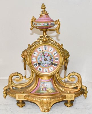Lot 99 - A French gilt metal pink porcelain mounted...