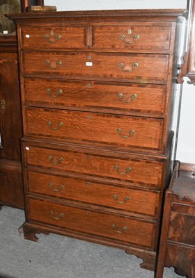 Lot 1074 - A George III oak chest on chest, crossbanded...