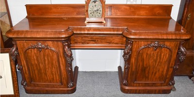 Lot 1072 - A 19th century mahogany breakfront twin...