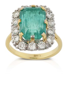 Lot 2304 - An Emerald and Diamond Cluster Ring