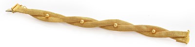 Lot 172 - A plaited mesh bracelet, stamped ‘750’, length...