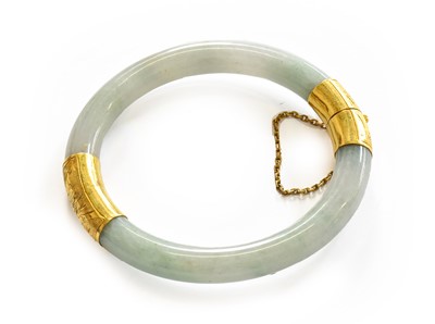 Lot 155 - A jade hinged bangle, two sections of jade...