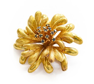 Lot 215 - A sapphire brooch, the yellow floral motif...