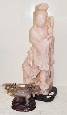 Lot 101 - A large Chinese rose quartz figure of Guanyin...