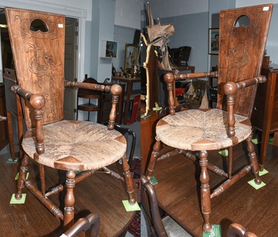 Lot 1114 - A pair of rush seated armchairs with dragon...