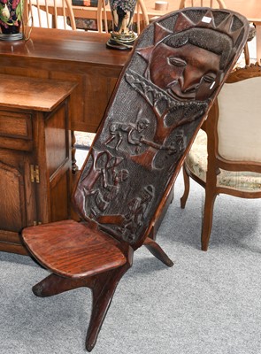 Lot 1292 - An African tribal carved hardwood birthing chair