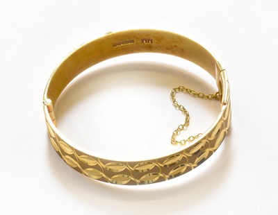 Lot 318 - A 9 Carat Gold Bangle, inner measurements...