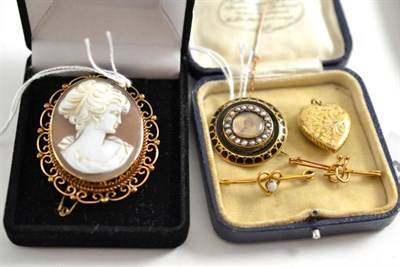 Lot 9 - A cameo brooch, a mourning brooch, a locket and two bar brooches