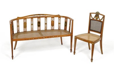 Lot 1240 - An Edwardian Satinwood and Polychrome Decorated Settee, early 20th century, with caned seat and...