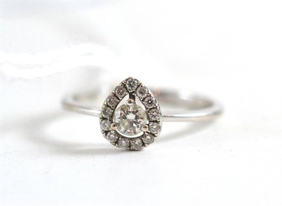 Lot 14 - A diamond cluster ring, round brilliant cut diamonds creating a pear-drop shape, stamped '18k'...