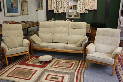 Lot 1197 - An Ercol Light Elm Three Piece Suite,...