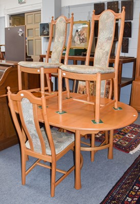 Lot 1173 - An Ercol light elm extending dining table,...