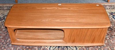 Lot 1248 - An Ercol light elm coffee table incorporating...