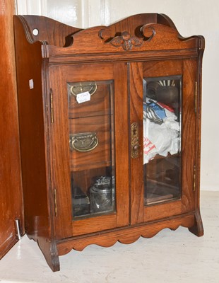 Lot 78 - An oak smoker's cabinet containing pipes,...