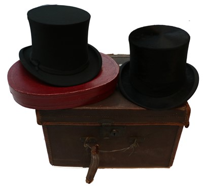 Lot 2228 - Dunn & Co Black Silk Top Hat in a brown...