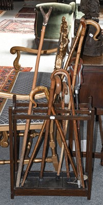 Lot 1309 - A stick stand and assorted walking sticks...