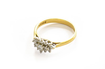 Lot 218 - An 18 carat gold diamond cluster ring, finger...