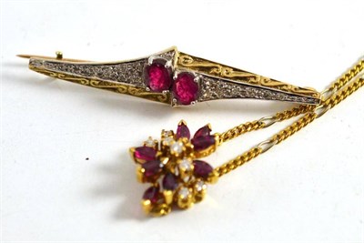 Lot 22 - A ruby and diamond set pendant with attached chain with clasp stamped '750' and a ruby set brooch