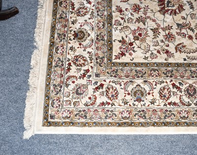 Lot 1206 - Machine made carpet, the ivory of scrolling...