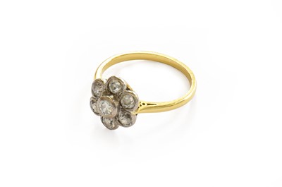 Lot 209 - An 18 carat gold diamond cluster ring, finger...