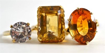 Lot 26 - Three 9ct gold rings, two set with citrine, one with cubic zirconia (3)