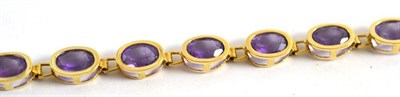 Lot 30 - An amethyst bracelet, stamped '585' and '14K'