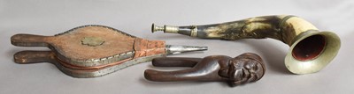 Lot 34 - Black Forest nutcrackers, horn and bellows