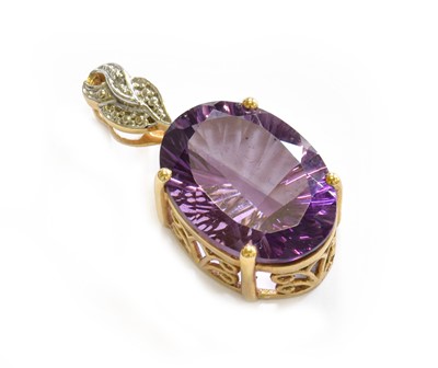 Lot 213 - A 9 carat gold amethyst and diamond pendant,...