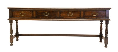 Lot 778 - An Oak Low Dresser, the moulded plank top...