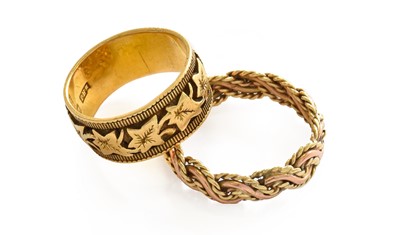 Lot 158 - An 18 carat gold textured band ring, finger...