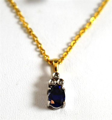 Lot 45 - A 9ct gold sapphire and diamond pendant on an 18ct gold chain