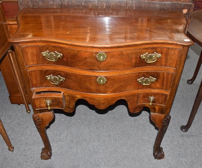 Lot 1157 - A 19th century walnut serpentine four drawer...