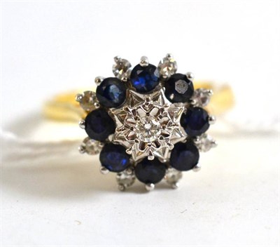 Lot 49 - An 18ct gold diamond and sapphire cluster ring