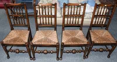 Lot 1090 - A set of four 19th century oak rush seated and...