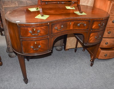 Lot 1135 - An inlaid mahogany kidney form dressing table,...