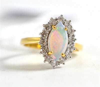 Lot 53 - An 18ct gold opal and diamond cluster ring, total estimated diamond weight 0.60 carat approximately