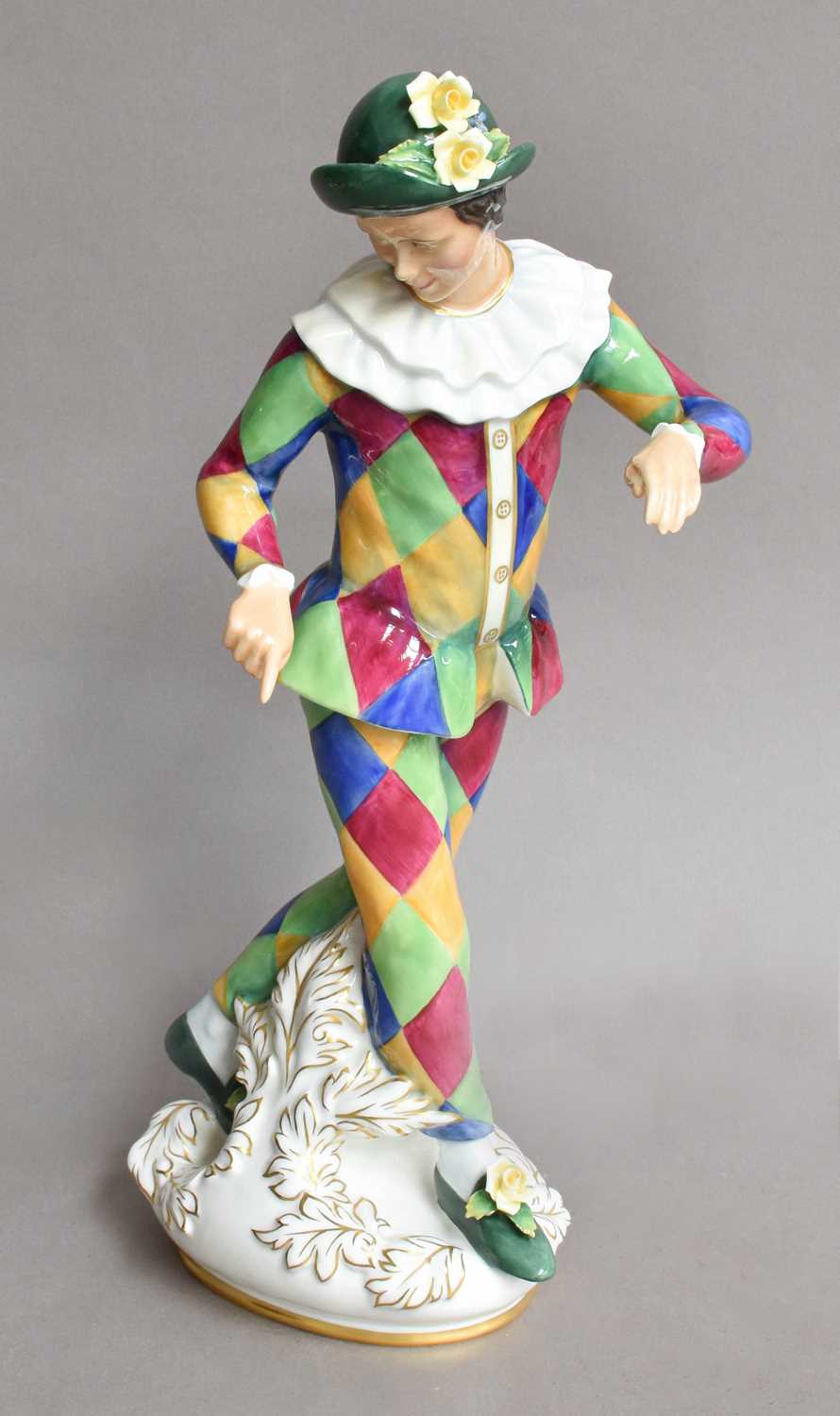 Lot 27 - A Royal Doulton figure 'Harlequin' modelled by...