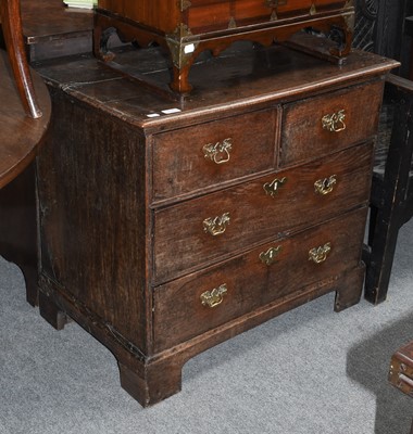 Lot 1143 - An 18th century oak three-height chest of...