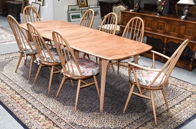 Lot 1286 - An Ercol blonde beech dining suite comprising...