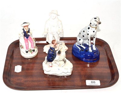 Lot 88 - Staffordshire black spot dog and three others