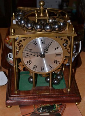 Lot 90 - A brass spherical weight clock