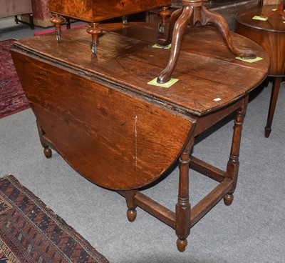 Lot 1136 - An 18th century oak gateleg single drawer...