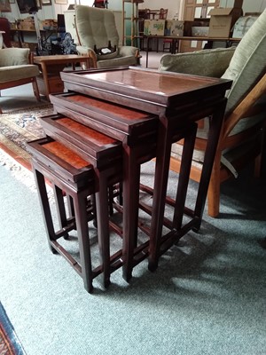 Lot 1249 - A nest of four Chinese hardwood tables, with...