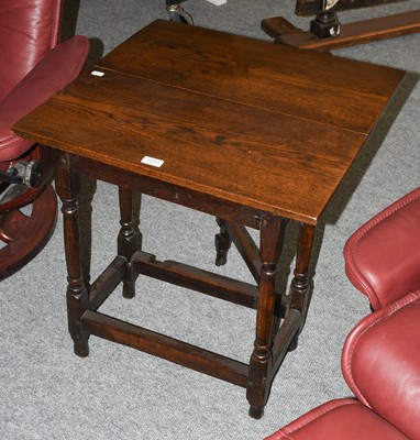 Lot 1237 - A 19th century oak single drop leaf occasional...