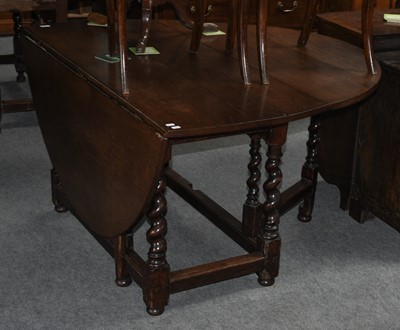 Lot 1132 - An 18th century oak gateleg dining table on...