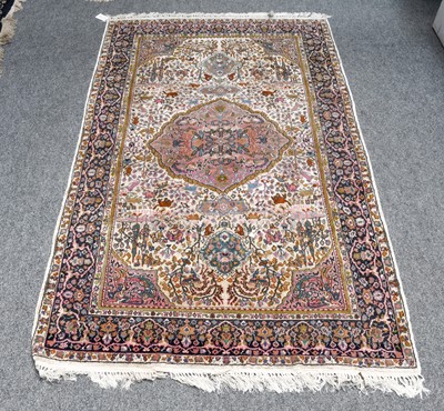 Lot 1203 - A Turkish Prayer Rug, the ivory field beneath...